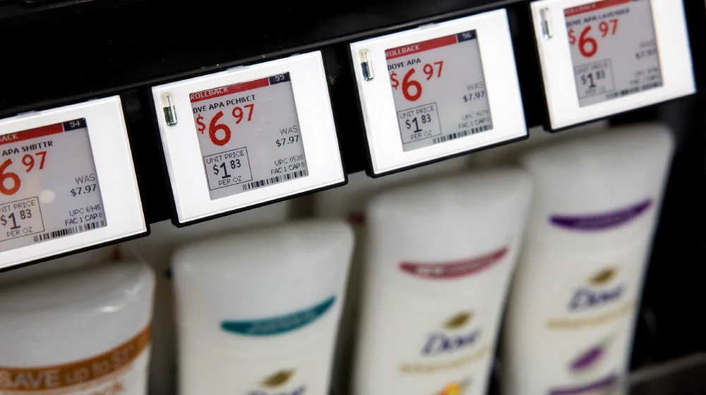 Reusable electronic shelf labels display product prices at Walmart.